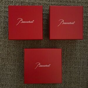 3 red Baccarat boxes